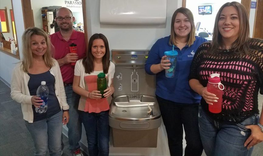 Staff celebrating new water fountain